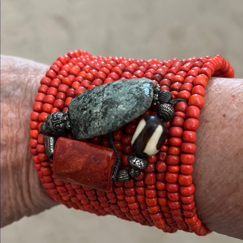 Vibrant Red Beaded Bracelet with Striking Centerpiece